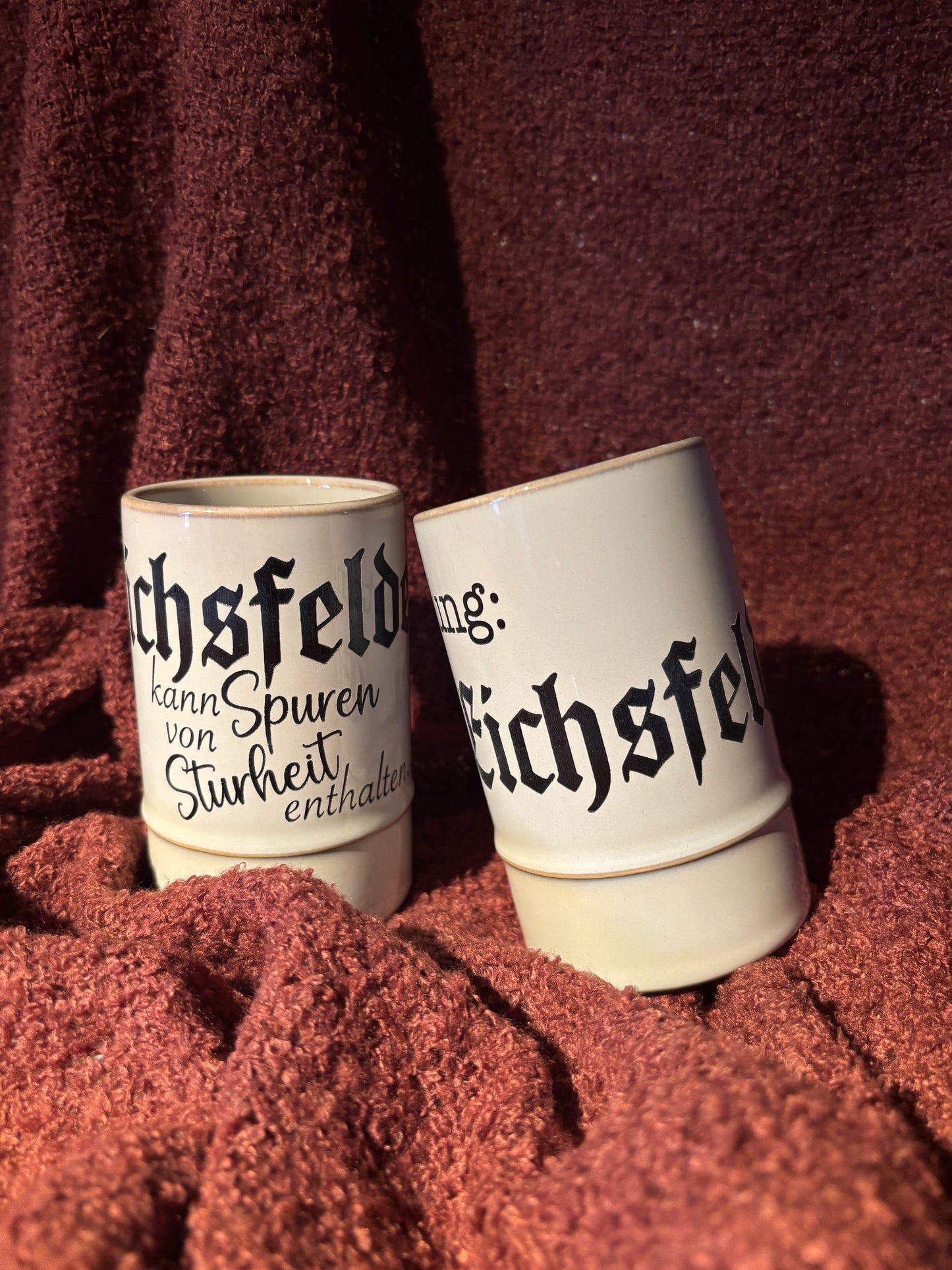 Keramiktasse mit Schriftzug